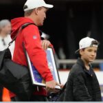 AFC coach Peyton Manning (left) and son Marshall Manning during Pro Bowl Games practice at Allegiant Stadium.