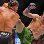 Brian Ortega of the United States (red gloves) fights Diego Lopes of Brazil (blue bloves) during Riyadh Season Noche UFC 306 at The Sphere.