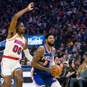 Philadelphia 76ers forward Paul George (8) drives past Golden State Warriors forward Jonathan Kuminga (00) during the first quarter at Chase Center.