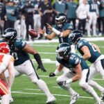 Philadelphia Eagles quarterback Jalen Hurts (1) takes a snap against the Kansas City Chiefs during the second half of Super Bowl LIX at Caesars Superdome.