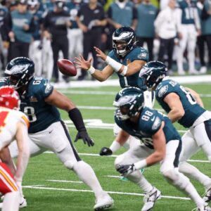 Philadelphia Eagles quarterback Jalen Hurts (1) takes a snap against the Kansas City Chiefs during the second half of Super Bowl LIX at Caesars Superdome.