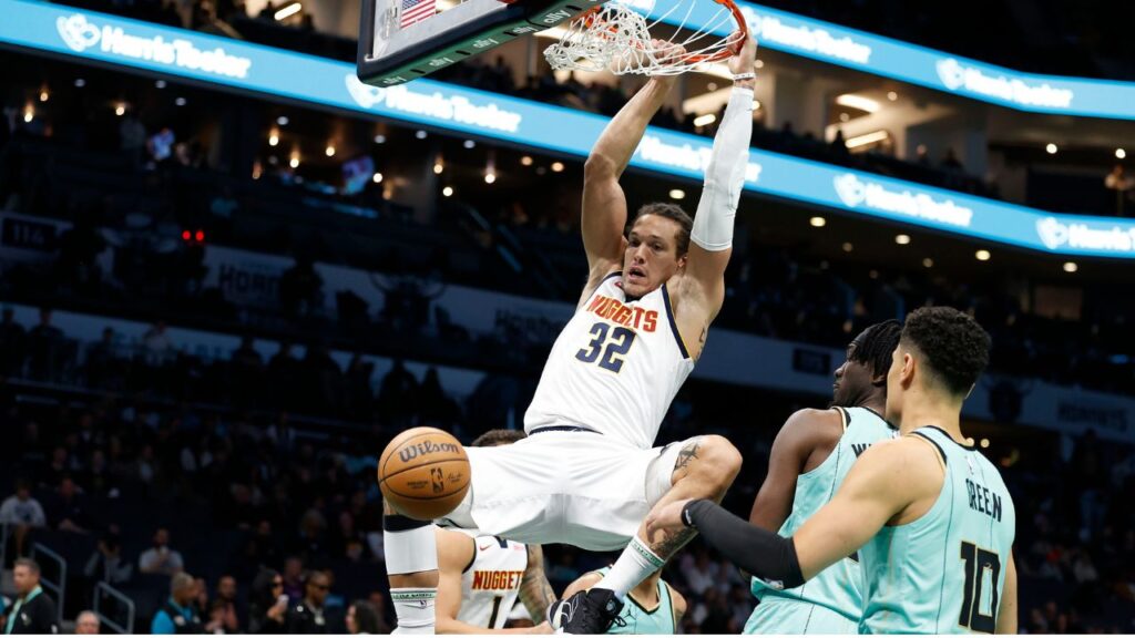 Feb 1, 2025; Charlotte, North Carolina, USA; Denver Nuggets forward Aaron Gordon (32) follows through on a slam dunk during the first quarter against the Charlotte Hornets at Spectrum Center. Mandatory Credit: Brian Westerholt-Imagn Images