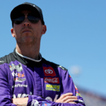 May 11, 2024; Darlington, South Carolina, USA; NASCAR Cup Series driver Denny Hamlin (11) during qualifying for the Goodyear 400 at Darlington Raceway. Mandatory Credit: Peter Casey-Imagn Images