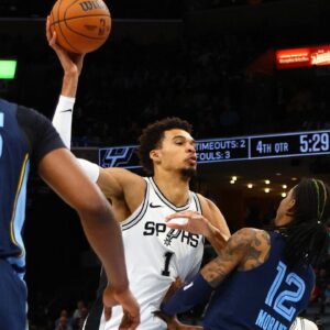 San Antonio Spurs center Victor Wembanyama (1) drives to the basket as Memphis Grizzlies guard Ja Morant (12) defends during the fourth quarter at FedExForum.
