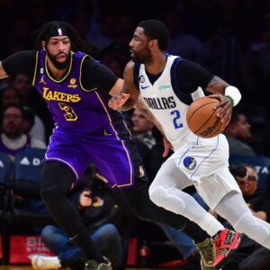 Dallas Mavericks guard Kyrie Irving (2) moves the ball against Los Angeles Lakers forward Anthony Davis (3) during the second half at Crypto.com Arena