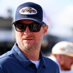 Feb 12, 2025; Daytona Beach, Florida, USA; NASCAR team owner Dale Earnhardt Jr. looks on during practice for the Daytona 500 at Daytona International Speedway. Mandatory Credit: Peter Casey-Imagn Images