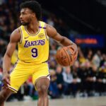 Los Angeles Lakers guard Bronny James (9) controls the ball against Los Angeles Clippers forward Drew Eubanks (15) during the second half at Intuit Dome.