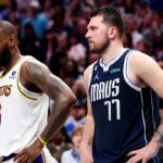 Los Angeles Lakers forward LeBron James (6) and Dallas Mavericks guard Luka Doncic (77) during the fourth quarter at American Airlines Center.