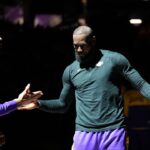 Los Angeles Lakers forward LeBron James (23) meets with forward Anthony Davis (3) before the start of the game against the Sacramento Kings at the Golden 1 Center.