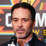 Jimmie Johnson talks with the media during a press conference at Phoenix Raceway. Jimmie Johnson finalized an ownership stake within the Petty GMS organization starting in 2023, and Johnson will also drive in select races for the team starting at the Daytona 500.