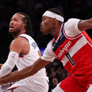 New York Knicks guard Jalen Brunson (11) is guarded by Washington Wizards guard Bilal Coulibaly (0) during the second half at Madison Square Garden