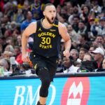Golden State Warriors guard Stephen Curry (30) reacts after making a three point basket during the second half against the Chicago Bulls at United Center.