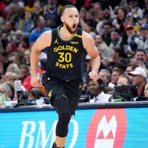 Golden State Warriors guard Stephen Curry (30) reacts after making a three point basket during the second half against the Chicago Bulls at United Center.