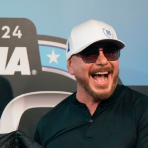 Pitbull gets a Daytona 500 jacket presented to him from Daytona International Speedway President Frank Kelleher during a press conference at Daytona International Speedway on Sunday, Feb. 18, 2024.