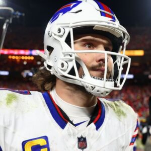 Buffalo Bills quarterback Josh Allen (17) walks off the field after the AFC Championship game against the Kansas City Chiefs at GEHA Field at Arrowhead Stadium.