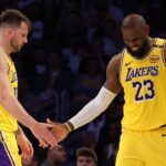 Los Angeles Lakers guard Luka Doncic (77) and forward LeBron James (23) celebrate after a play during the fourth quarter against the Minnesota Timberwolves at Crypto.com Arena