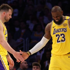 Los Angeles Lakers guard Luka Doncic (77) and forward LeBron James (23) celebrate after a play during the fourth quarter against the Minnesota Timberwolves at Crypto.com Arena