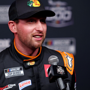 Feb 12, 2025; Daytona Beach, Florida, USA; NASCAR Cup Series driver Chase Briscoe (19) during Daytona 500 media day at Daytona International Speedway. Mandatory Credit: Peter Casey-Imagn Images