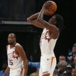Phoenix Suns center Bol Bol (11) shoots for three during the first quarter against the Memphis Grizzlies at FedExForum