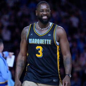 Marquette Golden Eagles player Dwyane Wade smiles timeout during the first half of the game against the Providence Friars at Fiserv Forum.