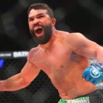 Patricio Freire (blue gloves) celebrates after defeating Michael Chandler (red gloves) during Bellator 221 at Allstate Arena.