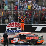 Apr 14, 2024; Fort Worth, Texas, USA; NASCAR Cup Series driver Chase Elliott (9) celebrates at the start finish line after winning the NASCAR Cup Series AutoTrader EchoPark 400 at Texas Motor Speedway. Mandatory Credit: Michael C. Johnson-Imagn Images