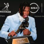 Colorado Buffaloes wide receiver/cornerback Travis Hunter poses for a photo after winning the Heisman Trophy award during the 2024 Heisman Trophy Presentation.