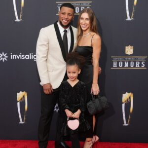 Saquon Barkley with Anna Congdon and daughter Jada Clare Barkley on the red carpet before the NFL Honors show at Resorts World Theatre.