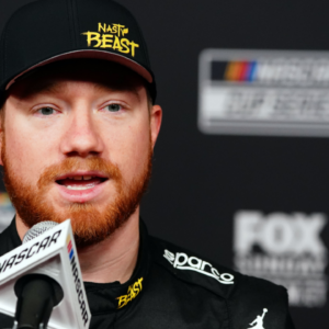 Feb 14, 2024; Daytona Beach, Florida, USA; NASCAR Cup Series driver Tyler Reddick (45) speaks with reporters during media day at Daytona International Speedway. Mandatory Credit: John David Mercer-Imagn Images