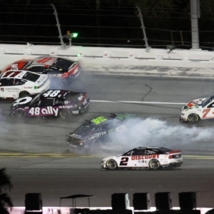 NASCAR Cup Series driver Denny Hamlin (11), driver Cody Ware (51) and driver Ty Gibbs (54) wreck during the Daytona 500 at Daytona International Speedway.