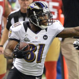 Feb 3, 2013; New Orleans, LA, USA; Baltimore Ravens wide receiver Anquan Boldin (81) stiff arms San Francisco 49ers defensive back Chris Culliver (29) as San Francisco 49ers head coach Jim Harbaugh reacts during the fourth quarter in Super Bowl XLVII at the Mercedes-Benz Superdome.