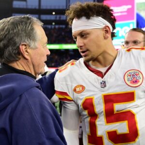 New England Patriots head coach Bill Belichick shakes hands with Kansas City Chiefs quarterback Patrick Mahomes (15) after a game at Gillette Stadium.