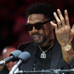 Udonis Haslem speaks after his jersey was lifted to the rafters during the retirement ceremony during halftime of the game between the Miami Heat and the Atlanta Hawks Kaseya Center.