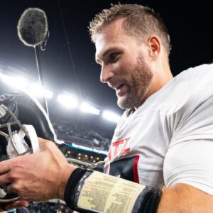 Atlanta Falcons quarterback Kirk Cousins (18) removes his helmet after a victory Philadelphia Eagles at Lincoln Financial Field.