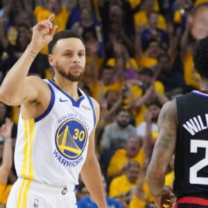 Golden State Warriors guard Stephen Curry (30) celebrates against LA Clippers guard Lou Williams (23) during the first quarter in game one of the first round of the 2019 NBA Playoffs at Oracle Arena.