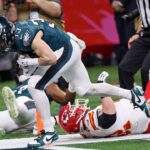 Philadelphia Eagles cornerback Cooper DeJean (33) scores a touchdown after making an interception against the Kansas City Chiefs during the first half of Super Bowl LIX at Caesars Superdome.