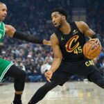 Boston Celtics center Al Horford (42) defends Cleveland Cavaliers guard Donovan Mitchell (45) in the first quarter at Rocket Mortgage FieldHouse
