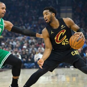 Boston Celtics center Al Horford (42) defends Cleveland Cavaliers guard Donovan Mitchell (45) in the first quarter at Rocket Mortgage FieldHouse