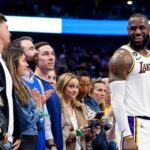 Los Angeles Lakers forward LeBron James (6) laughs with Kansas City Chiefs quarterback Patrick Mahomes during the fourth quarter against the Dallas Mavericks at American Airlines Center.
