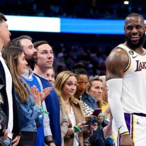 Los Angeles Lakers forward LeBron James (6) laughs with Kansas City Chiefs quarterback Patrick Mahomes during the fourth quarter against the Dallas Mavericks at American Airlines Center.