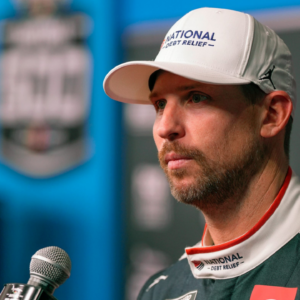 Denny Hamlin answers questions from reporters during Media Day at Daytona International Speedway, Wednesday, Feb. 12, 2025.