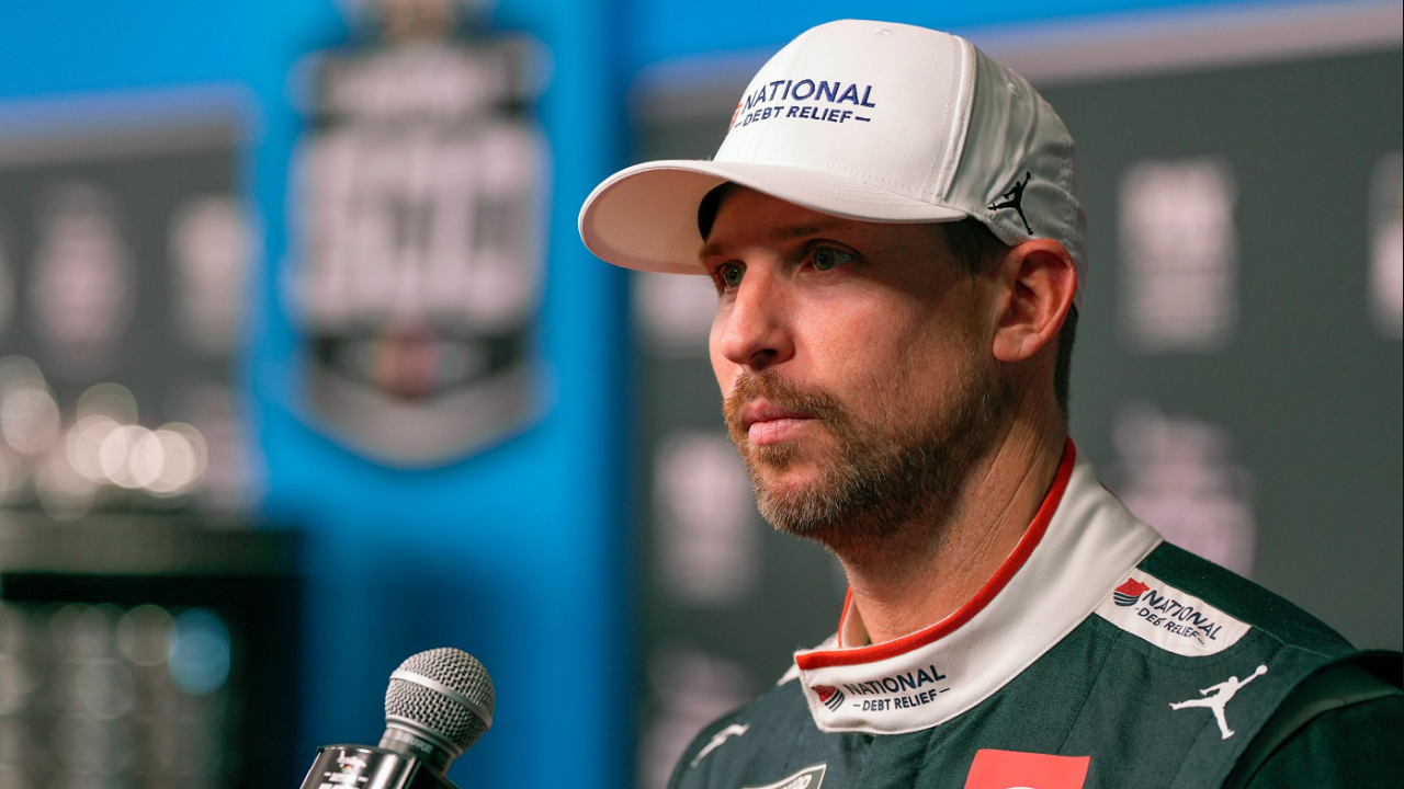 Denny Hamlin answers questions from reporters during Media Day at Daytona International Speedway, Wednesday, Feb. 12, 2025.