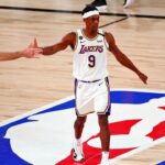 Los Angeles Lakers guard Rajon Rondo (9) is congratulated by guard Alex Caruso (4) after making a basket against the Miami Heat during the third quarter in game six of the 2020 NBA Finals at AdventHealth Arena.