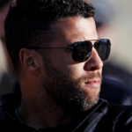 NASCAR Cup Series driver Bubba Wallace (23) walks the track before practice for the Clash at Bowman Gray at Bowman Gray Stadium.