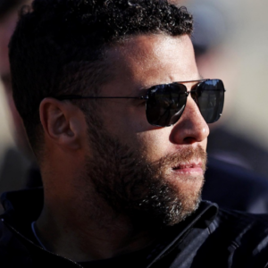 NASCAR Cup Series driver Bubba Wallace (23) walks the track before practice for the Clash at Bowman Gray at Bowman Gray Stadium.
