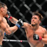 Henry Cejudo (red gloves) fights Song Yadong (blue gloves) in the bantamweight bout during UFC Fight Night at Climate Pledge Arena.