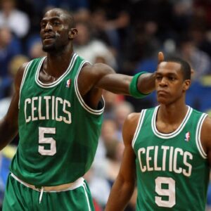 Boston Celtics forward Kevin Garnett (5) taps the head of guard Rajon Rondo (9) during the first quarter against the Minnesota Timberwolves at the Target Center. The Celtics defeated the Timberwolves 100-79