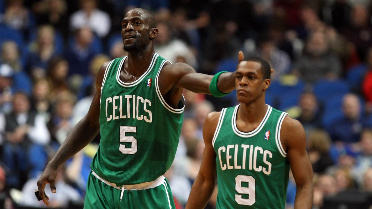 Boston Celtics forward Kevin Garnett (5) taps the head of guard Rajon Rondo (9) during the first quarter against the Minnesota Timberwolves at the Target Center. The Celtics defeated the Timberwolves 100-79