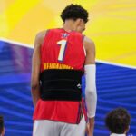 Chuckís Global Stars forward Victor Wembanyama (1) of the San Antonio Spurs stands on the sideline with a wrap during the 2025 NBA All Star Game at Chase Center.