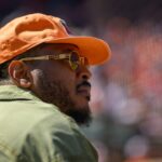 Former professional basketball player Carmelo Anthony attends a game between the Baltimore Orioles and the Tampa Bay Rays at Oriole Park at Camden Yards.